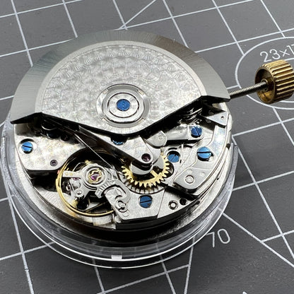 Black Dandong 7753 automatic watch with small second at 9 o'clock, showcasing elegant mechanical movement detail.