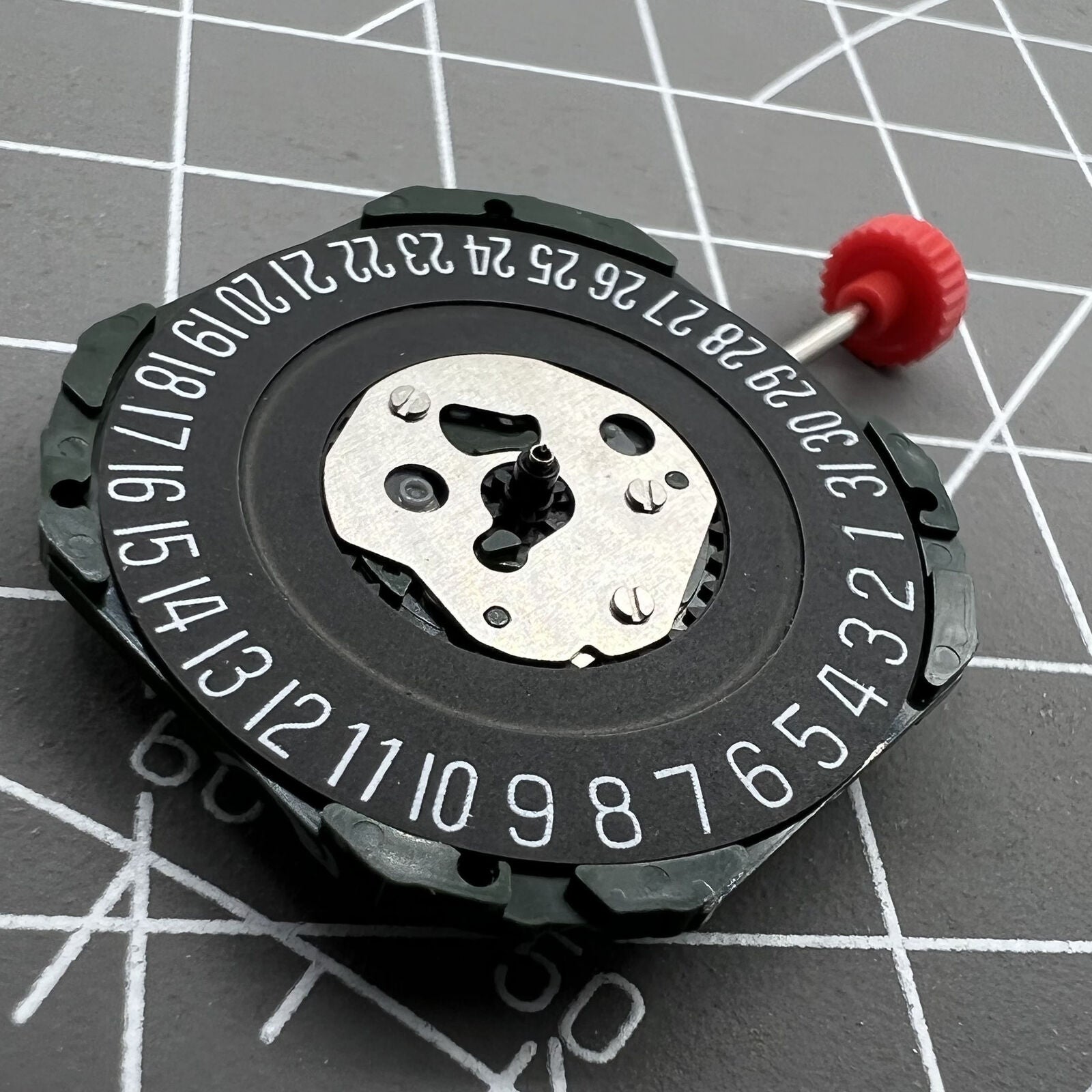 Black dial watch with Miyota 2315 quartz movement, 3 hands, date at 6, featuring watch stem.