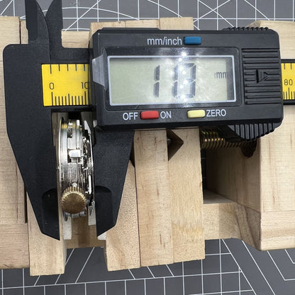 Black Dandong watch accessory featuring automatic mechanical movement and 9 o'clock small second dial for precise timekeeping.