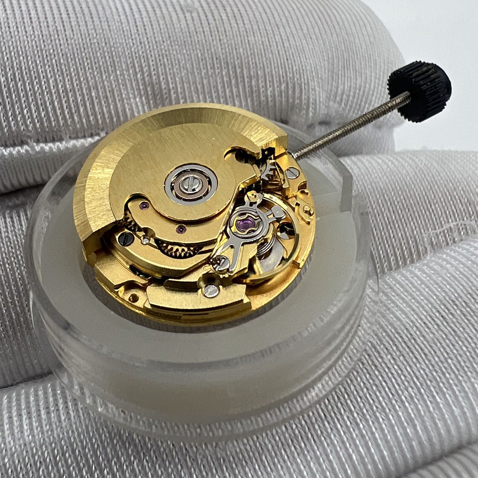 Golden ETA2671 mechanical watch movement with date display at 3 o'clock by ETA.