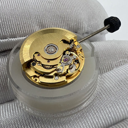 Golden ETA2671 mechanical watch movement with date display at 3 o'clock by ETA.