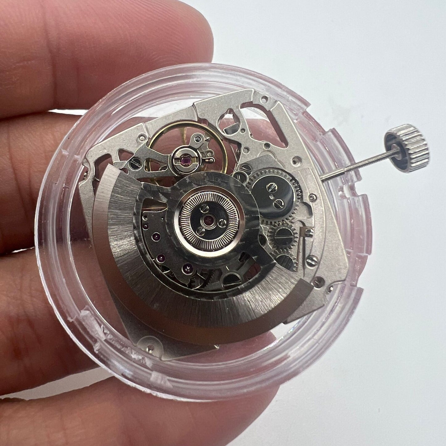 Tianjin Seagull ST25 silver automatic mechanical watch movement with 3 hands and hollow square design.