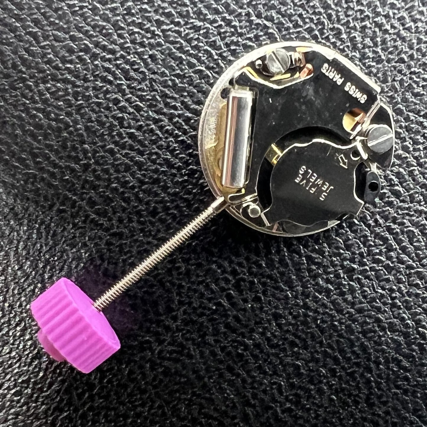 Ronda 1042 quartz movement with two hands, precise watch repair component for accurate timekeeping.