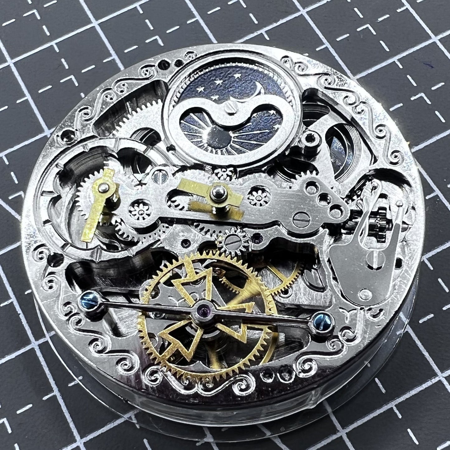 Small silver hollow watch movement with double mainspring and balance wheel at 6 o?clock by Kleines brand.