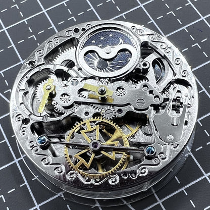 Small silver hollow watch movement with double mainspring and balance wheel at 6 o?clock by Kleines brand.