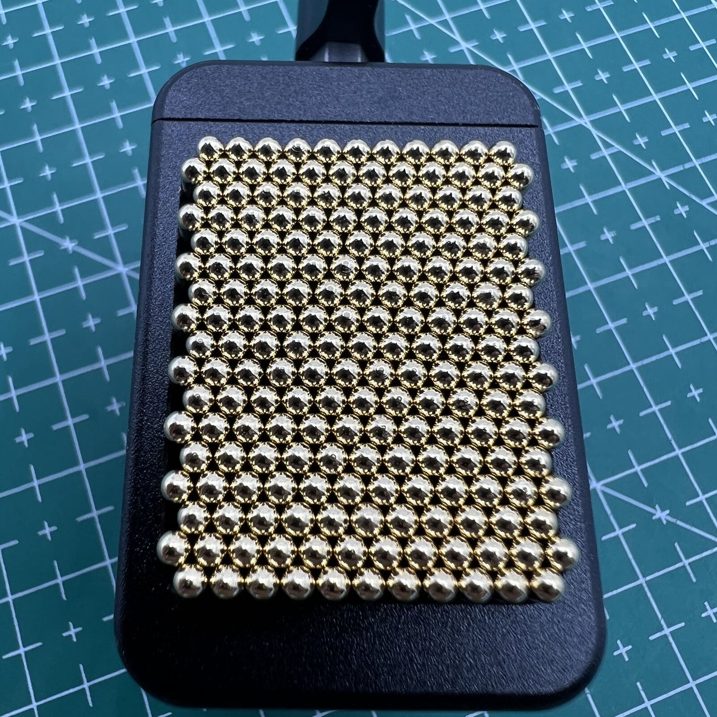 Universal metal movement holder with beads by Generic, fits all watch shapes for secure repair tasks.