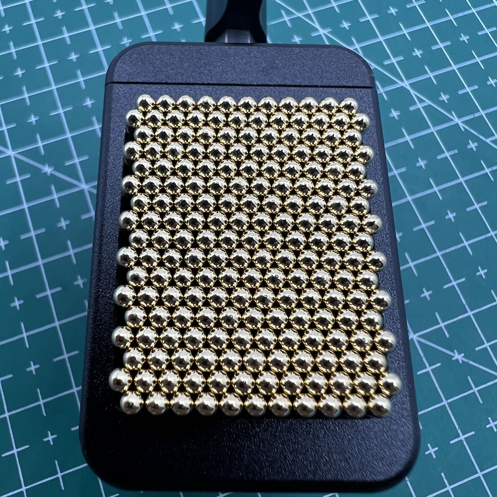 Universal metal movement holder with beads by Generic, fits all watch shapes for secure repair tasks.