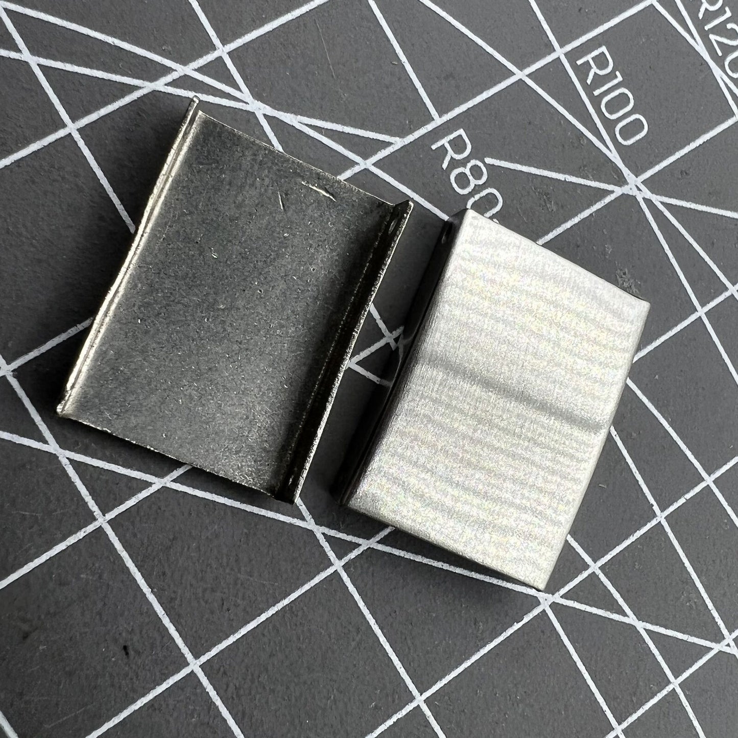 Set of 18 silver 3-fold watch strap buckles extenders in 9 sizes, perfect for versatile watch adjustments.