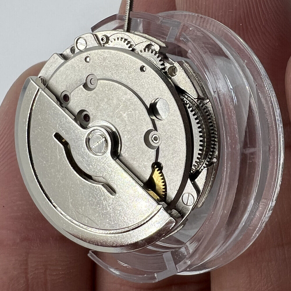 Dandong Silver automatic mechanical watch movement by China Made, featuring second stop for accurate timekeeping.