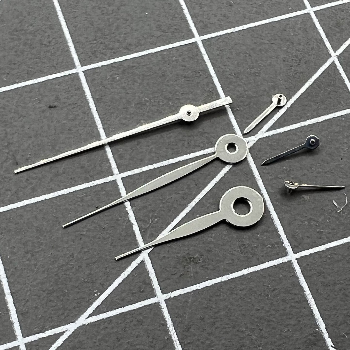 Silver 14mm long arrow watch hands, no lume, compatible with Miyota 0S11 movements, precise timing accessory.