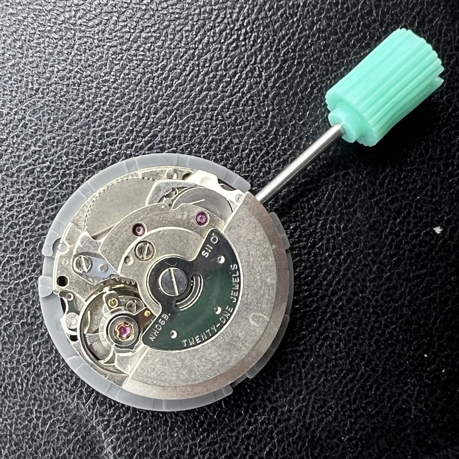 NH06A watch movement with double calendar date at 3 o'clock, precision Japanese mechanism by Seiko.