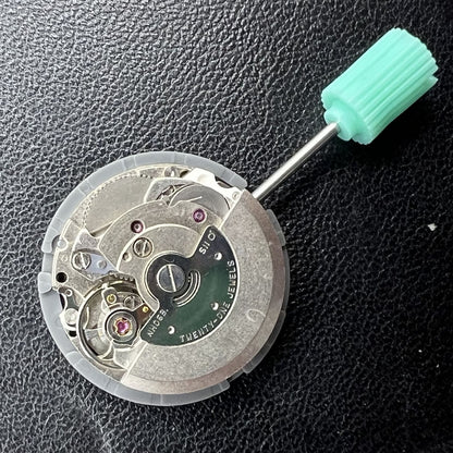 NH06A watch movement with double calendar date at 3 o'clock, precision Japanese mechanism by Seiko.