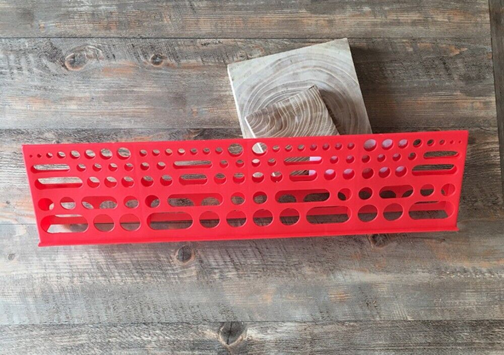 Wall-mounted tool board organizing screwdrivers and pliers for efficient workshop storage.