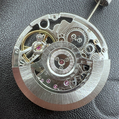 Tianjin Automatikwerk watch mechanism with 24 jewels, hand-engraved silver hollow design for premium watch accessories.