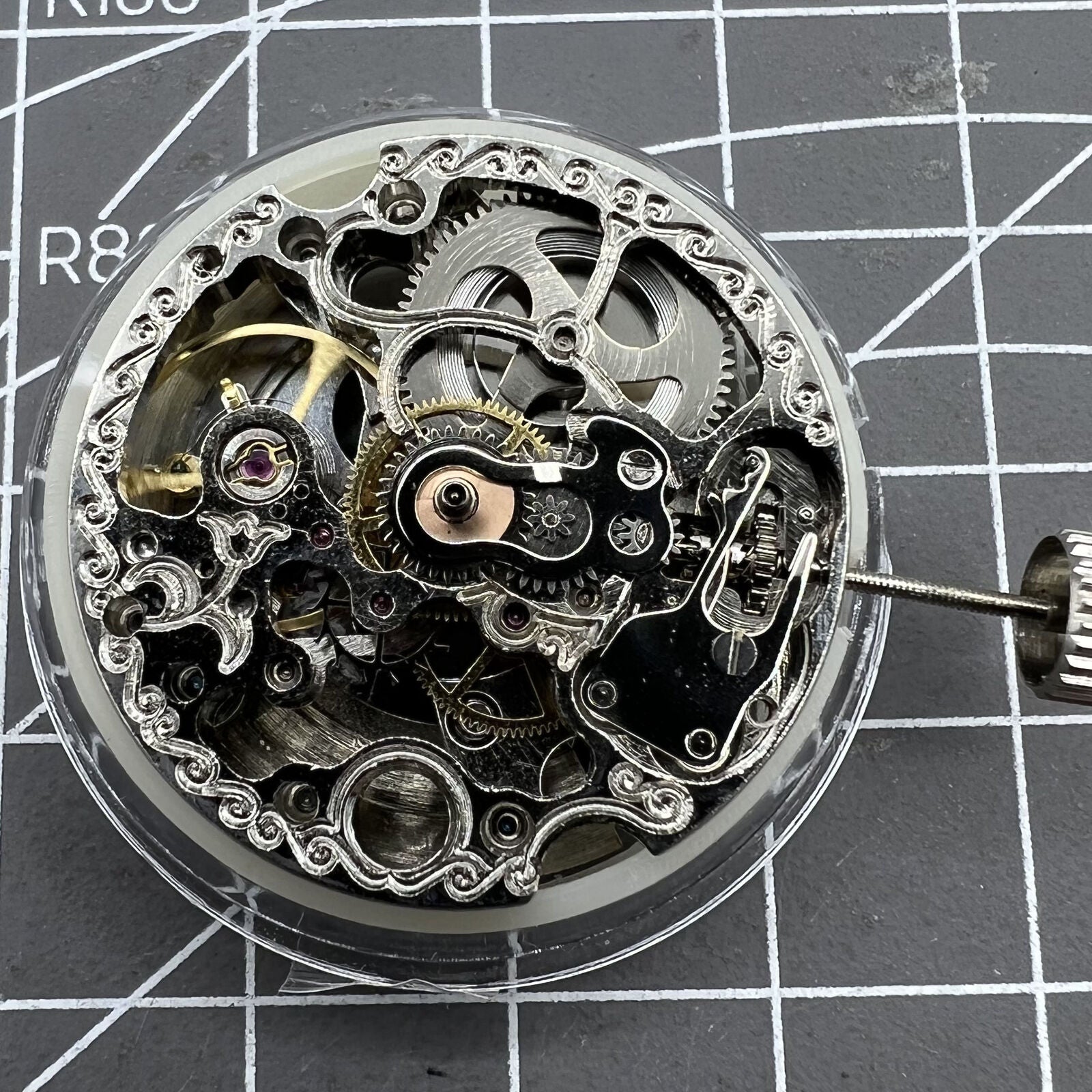 Carved Silver Hollow 7120 watch showcasing automatic mechanical movement, elegant watch accessory.