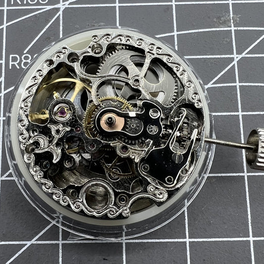 Carved Silver Hollow 7120 watch showcasing automatic mechanical movement, elegant watch accessory.