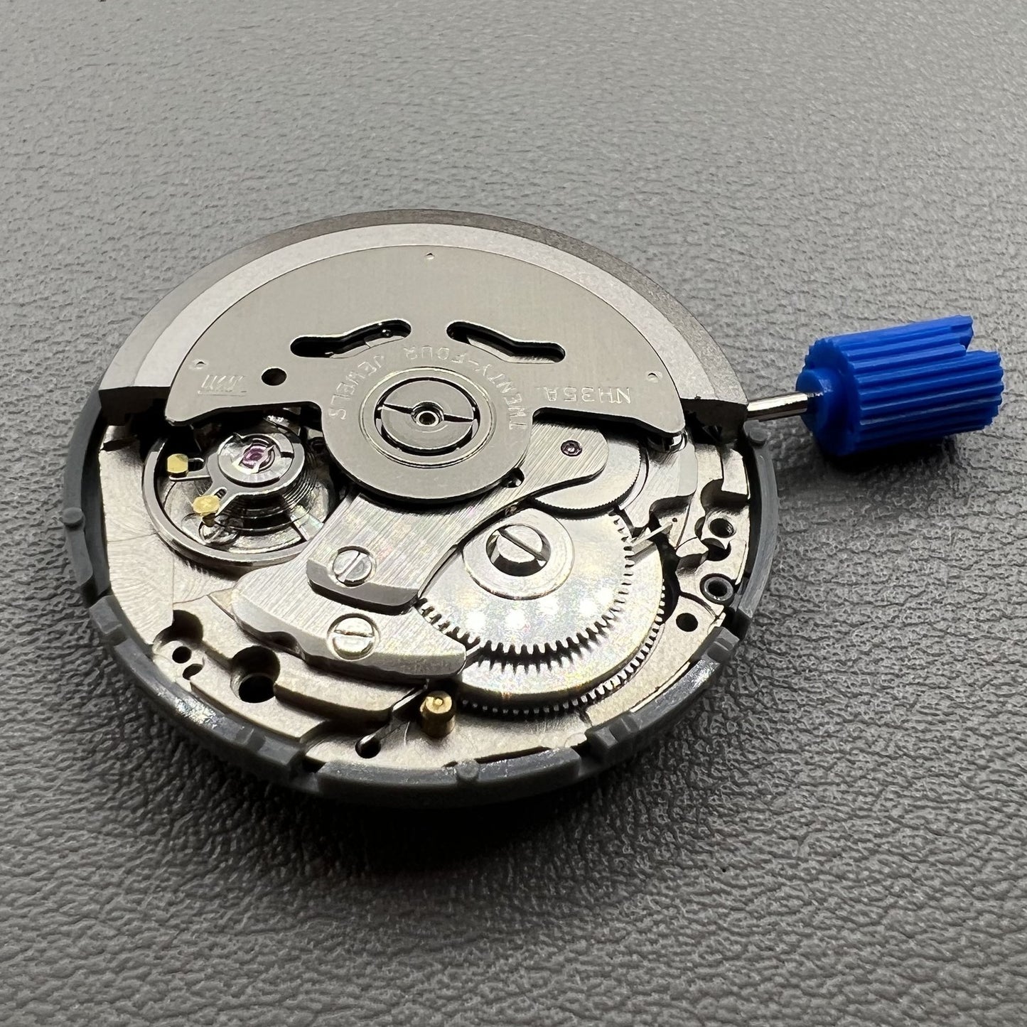 Japan NH35 automatic chronograph watch dial in black with date window and crown at 3 o?clock.