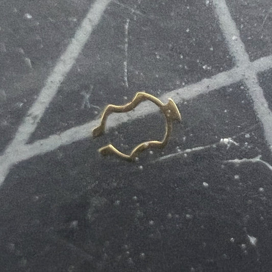 ETA watch movement plate click spring cap jewel close-up, precision component for watch repair.