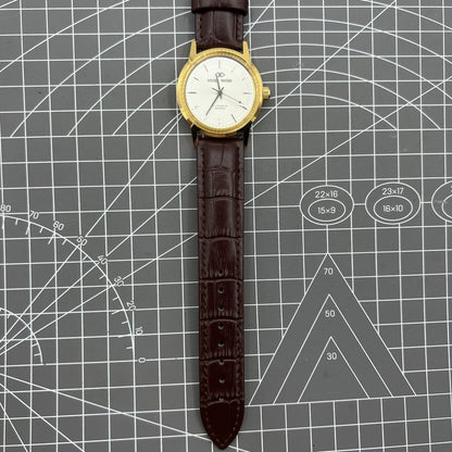 Beijing Double Rhomb mechanical watch with golden case, silver nail markers, and elegant classic design.