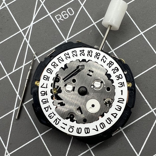 Orient KFB00 Japan quartz watch movement with date display at 3 o'clock on white disk replacement part