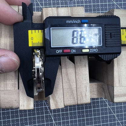 Small silver hollow watch movement with double mainspring and balance wheel at 6 o?clock by Kleines brand.