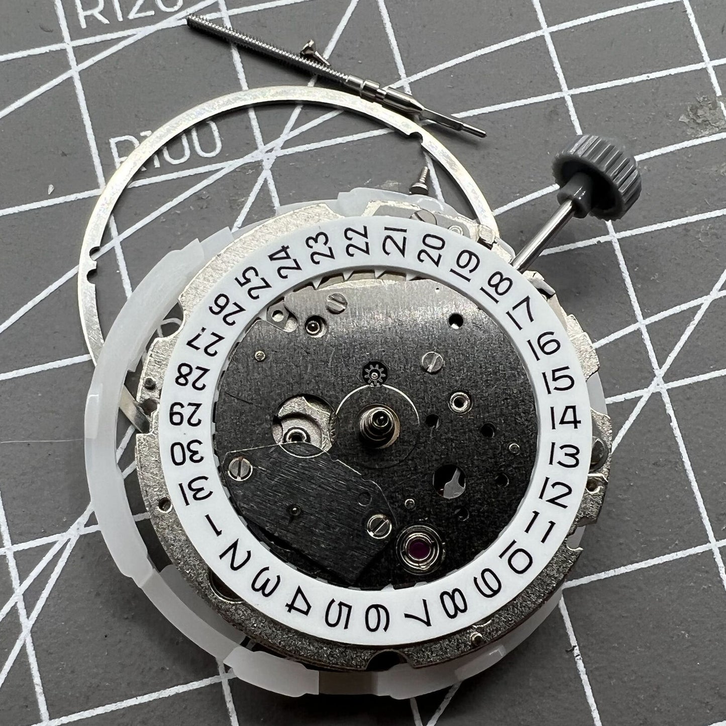 Miyota 8217 automatic watch movement showing 3 hands with small second at 9 o'clock position.