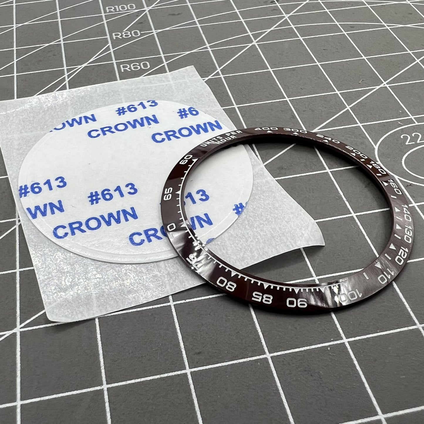 Ceramic watch bezel for Daytona, 37.65x30.7mm, brown slope with white font, durable accessory.