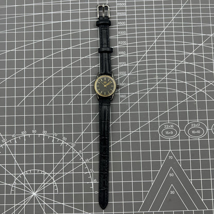 Black case Seagull ladies watch with golden nail markers, manual mechanical movement, and shock-resistant design.