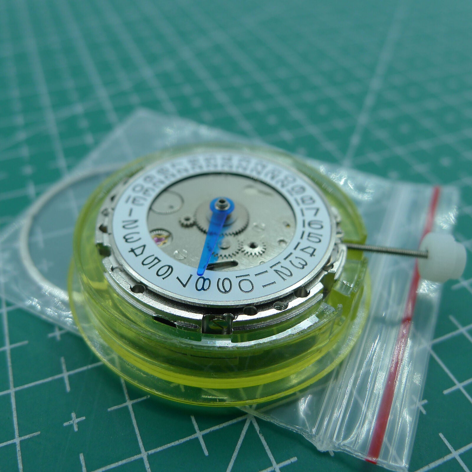 DG2813 mechanical watch movement with 4 hands and adjustable 24-hour GMT, silver finish for precision timepieces.