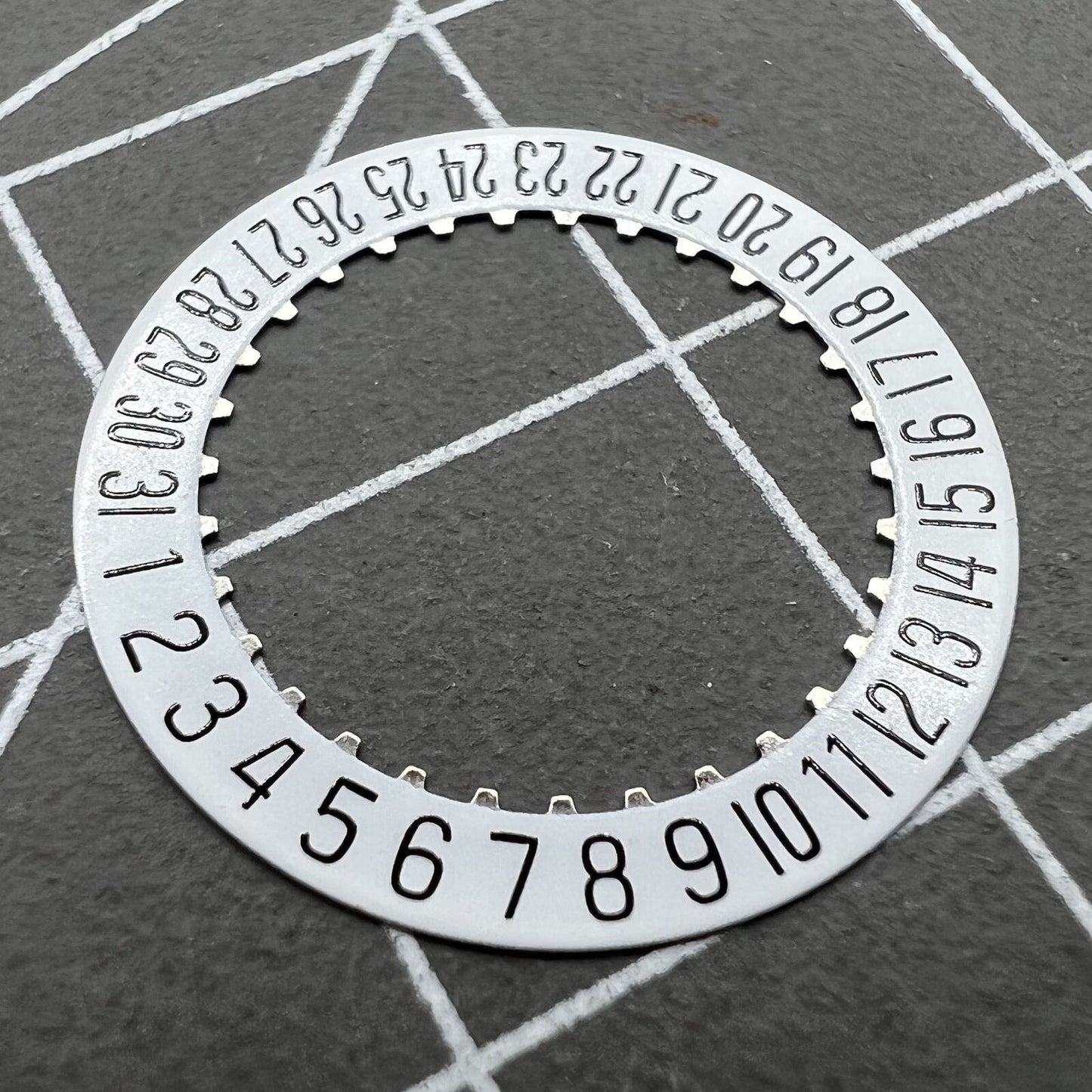 White date disk wheel for ETA 204.911 watch movement, precise fit for date function replacement.