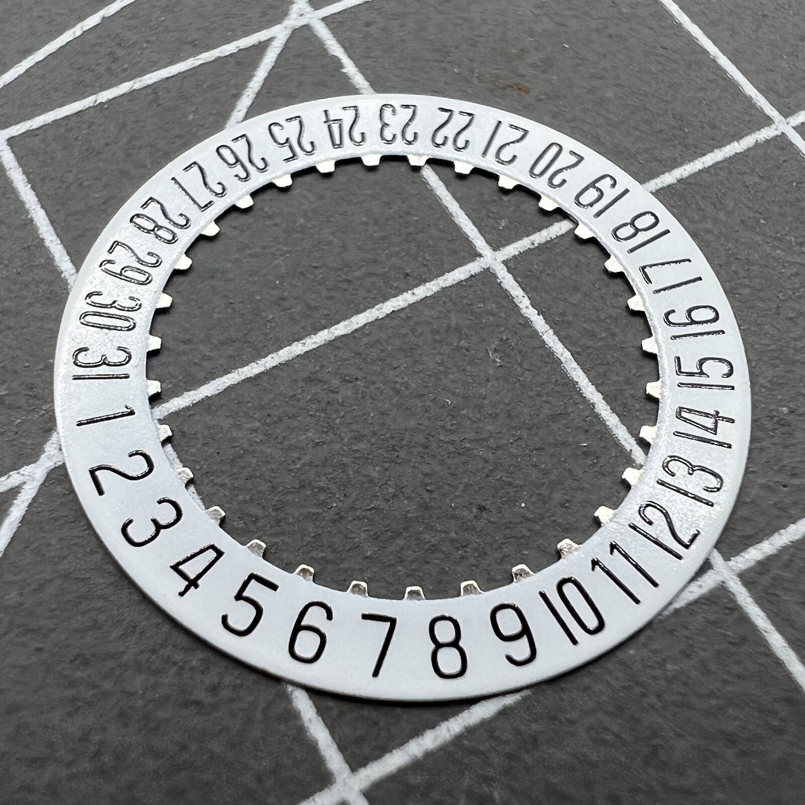 White date disk wheel for ETA 204.911 watch movement, precise fit for date function replacement.