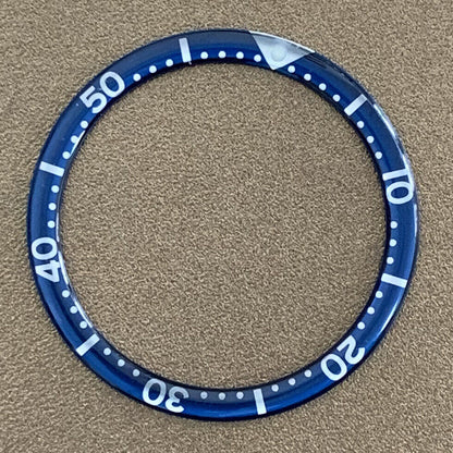 White font 39mm aluminum bezel insert with circular arc bevel for watch customization.