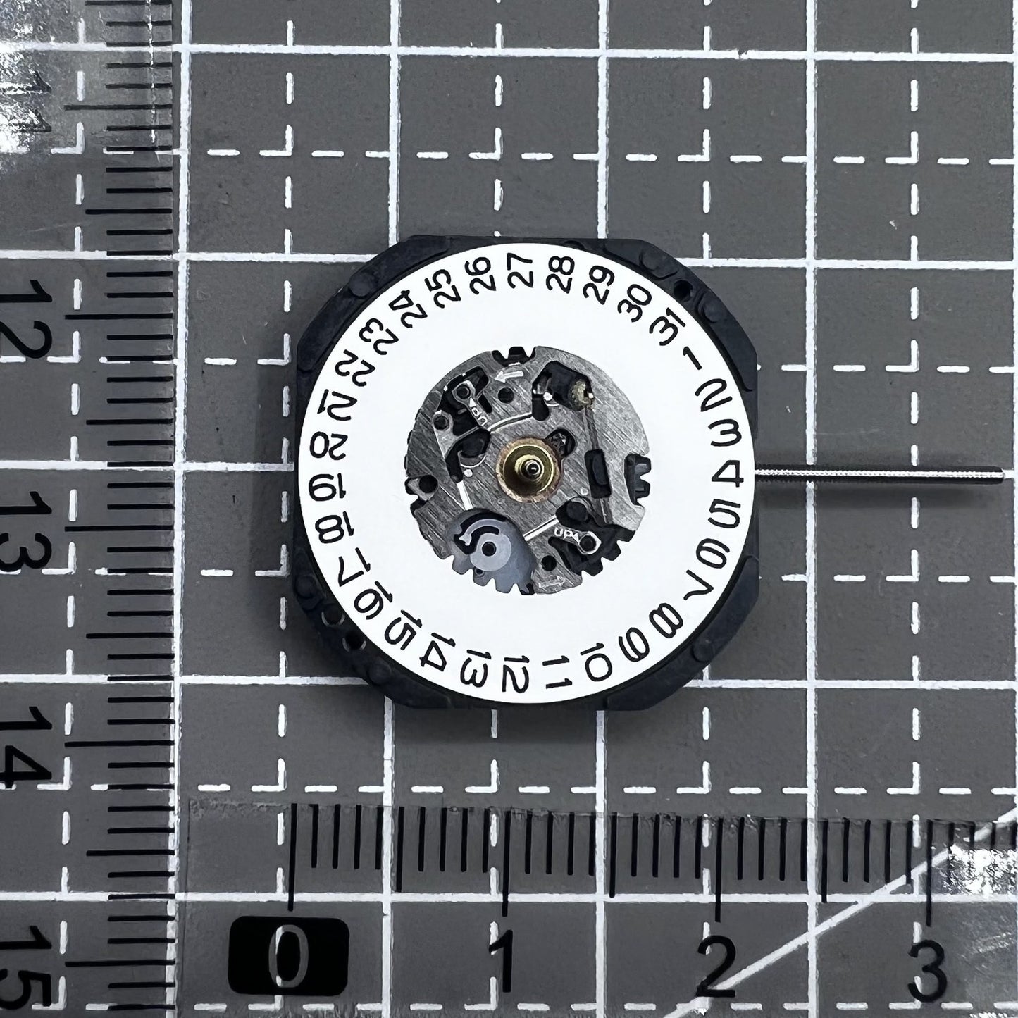 Seiko 7N32C Quartz watch movement showing three hands and single date at 3 o'clock for watch accessories.