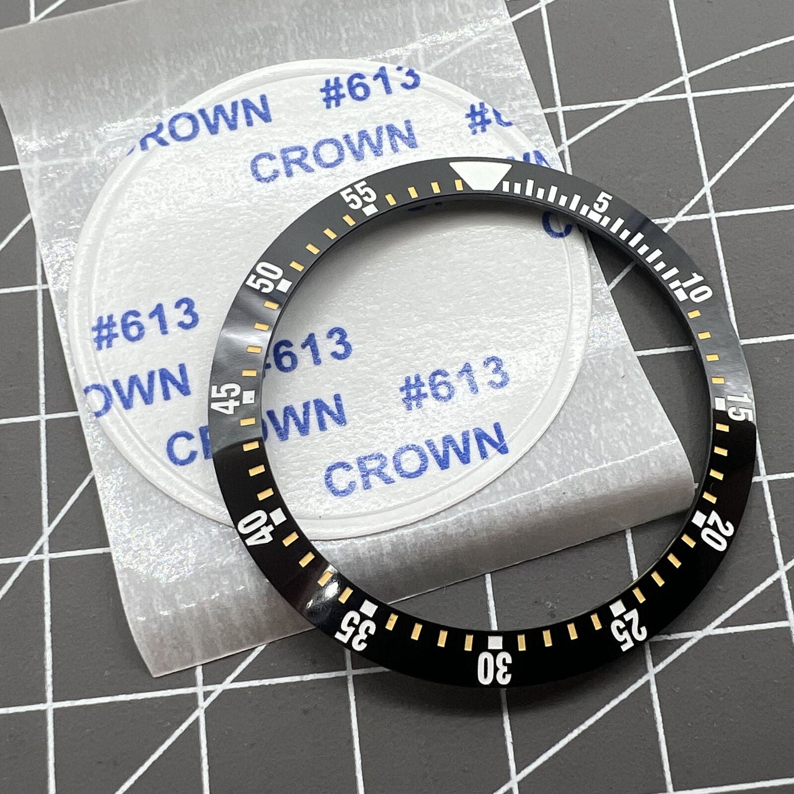 38mm black ceramic watch bezel insert with yellow graduation, durable watch part for precise timekeeping.