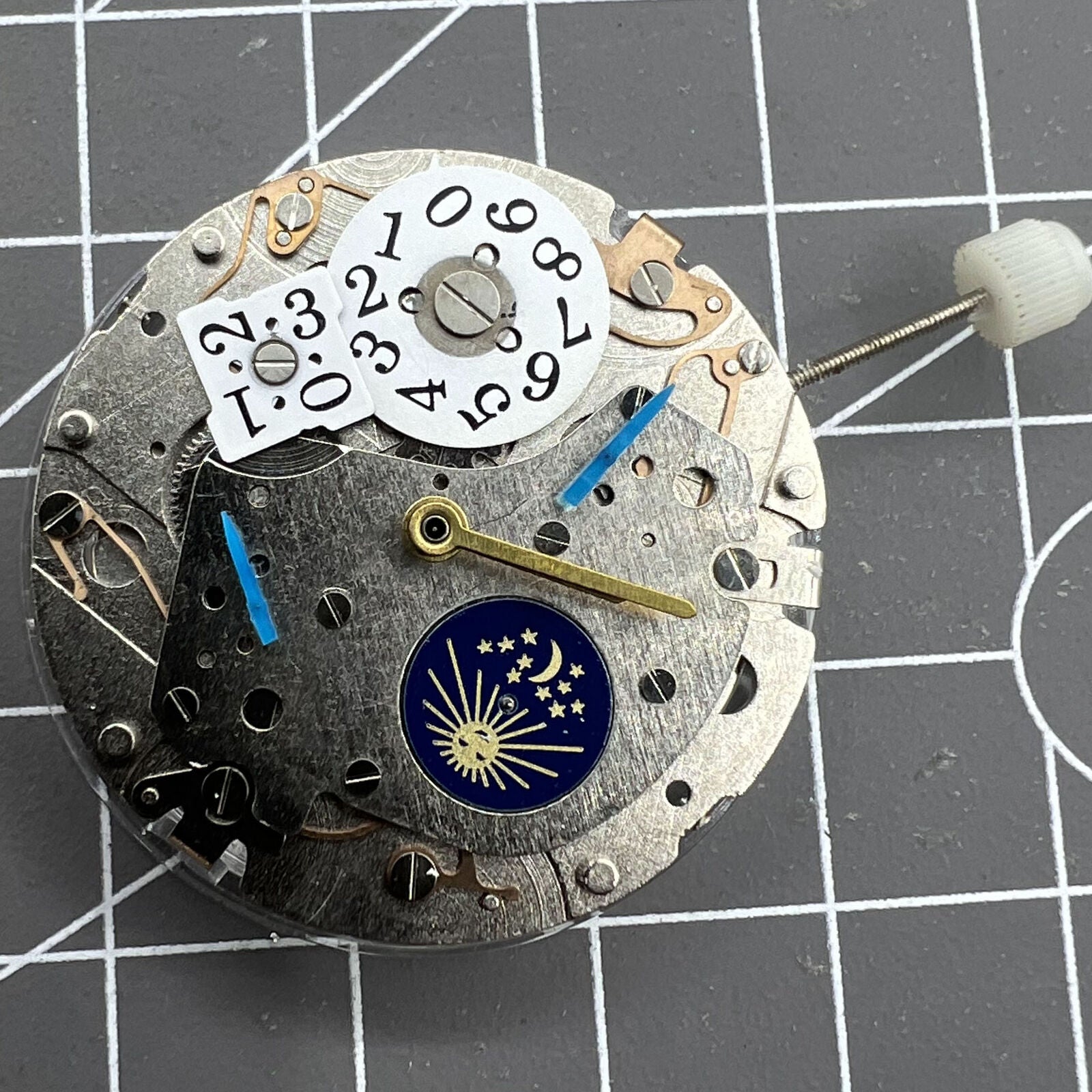 Mechanical automatic watch accessory featuring multi-function 3 hands and big date display at 12, branded for precision.