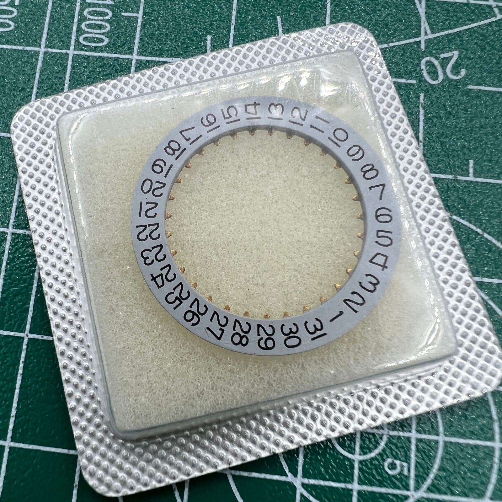 Wholesale lot of Omega 1020 1030 date disk wheels, original parts for watch movement repair.