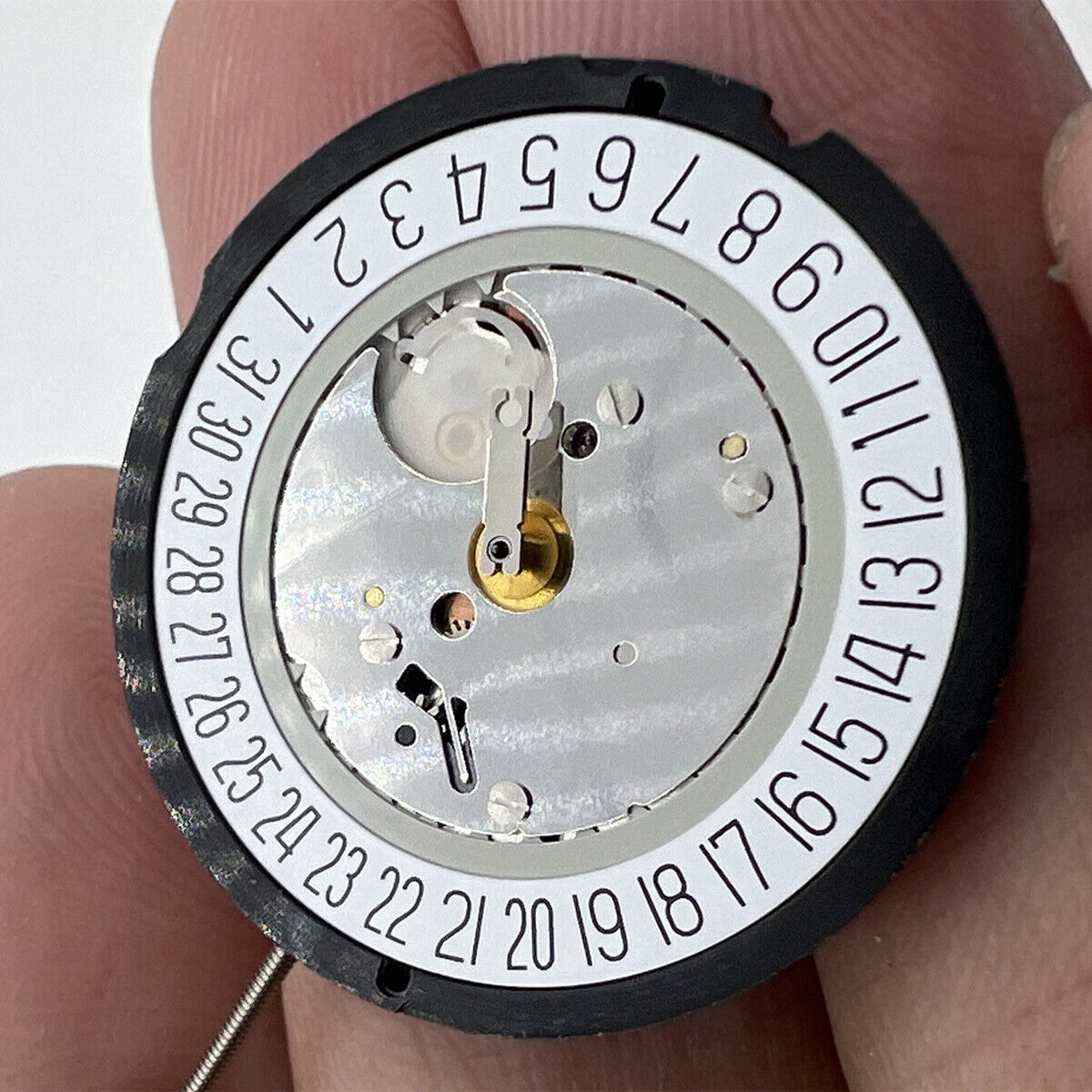 Ronda 515 Swiss quartz watch movement with date window at 6 o'clock, precise timekeeping components.