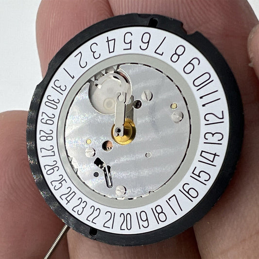 Ronda 515 Swiss quartz watch movement with date window at 6 o'clock, precise timekeeping components.