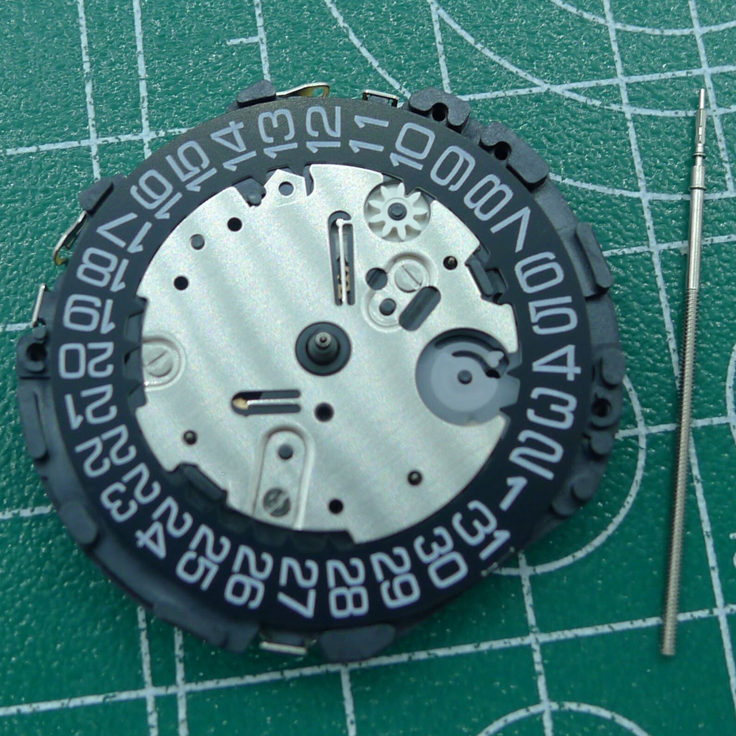 Wholesale Japan Made VR32B quartz watch movement with black dial, multifunctional features for precise timekeeping.