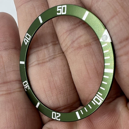 Green aluminum bezel insert for 39mm/32mm watches, enhancing style and durability.