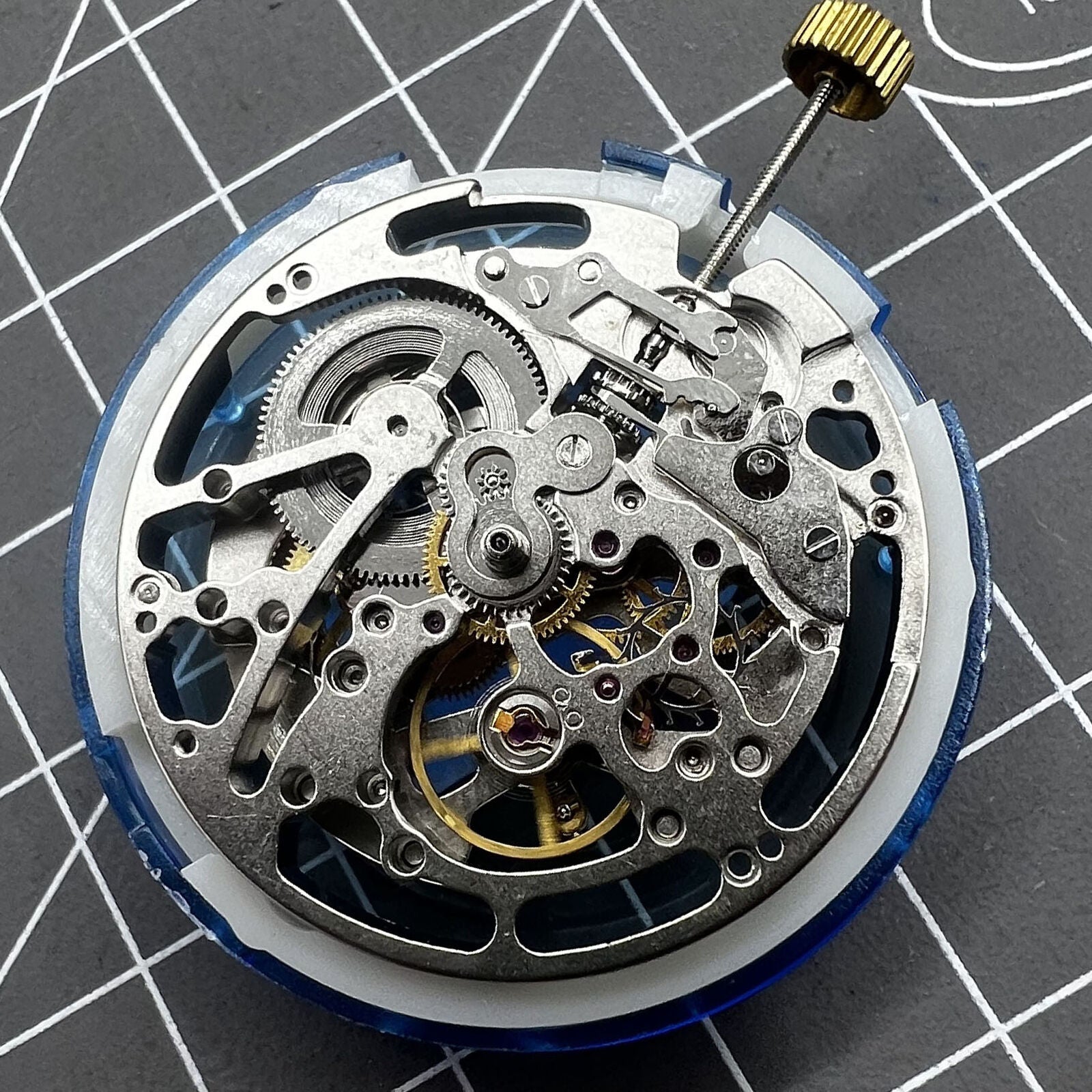 Dandong Silver watch accessory showcasing hollow automatic mechanical movement with second stop feature.