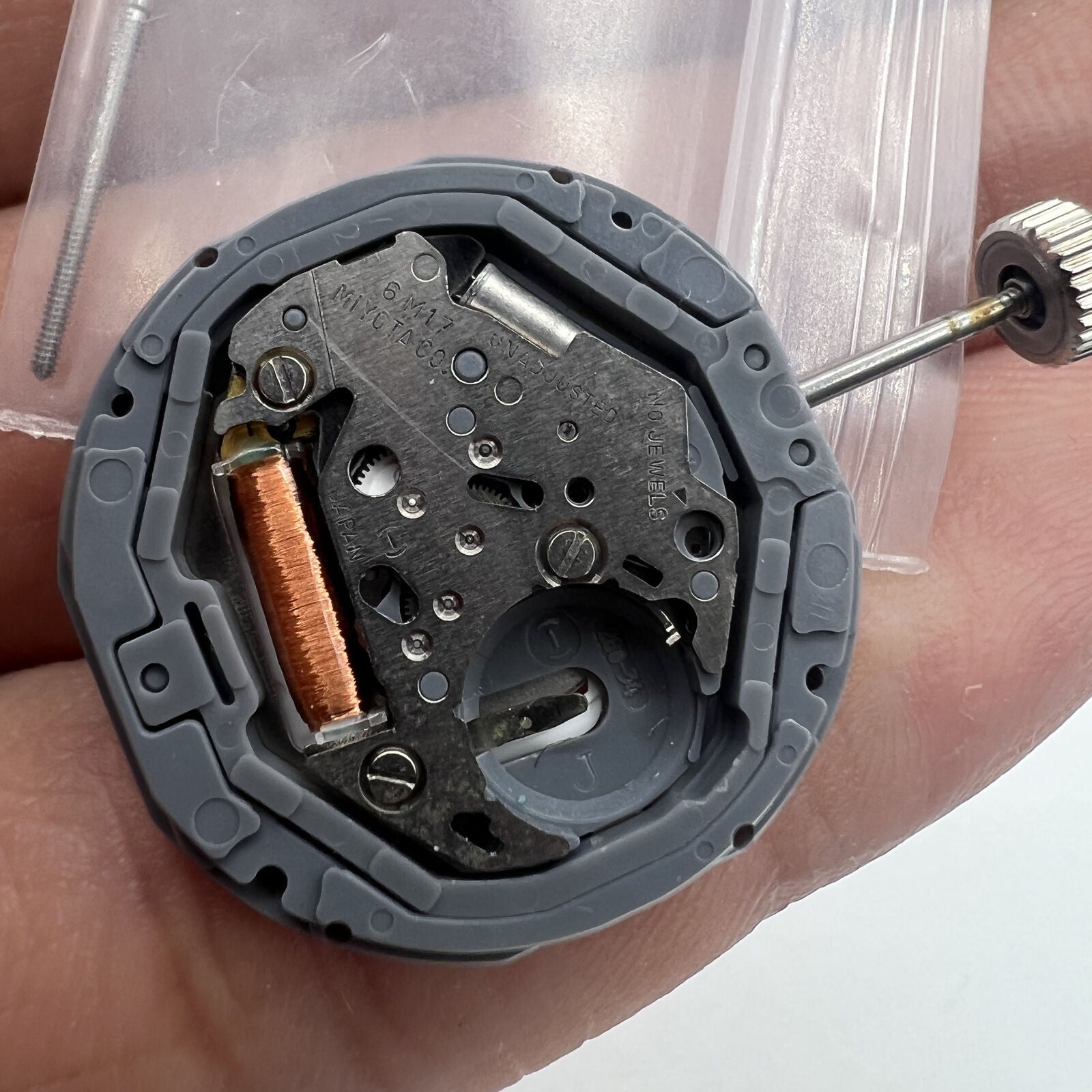Miyota 6M17 quartz watch movement with 3 hands, precise Japanese craftsmanship for watch repairs.