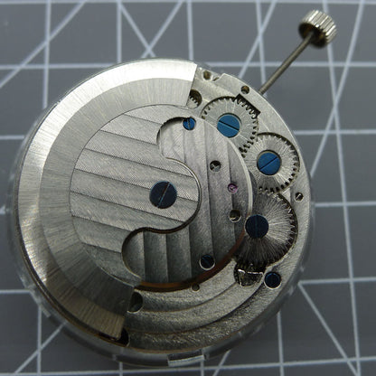 Multifunctional automatic mechanical watch featuring kinetic energy tourbillon for precise timekeeping.
