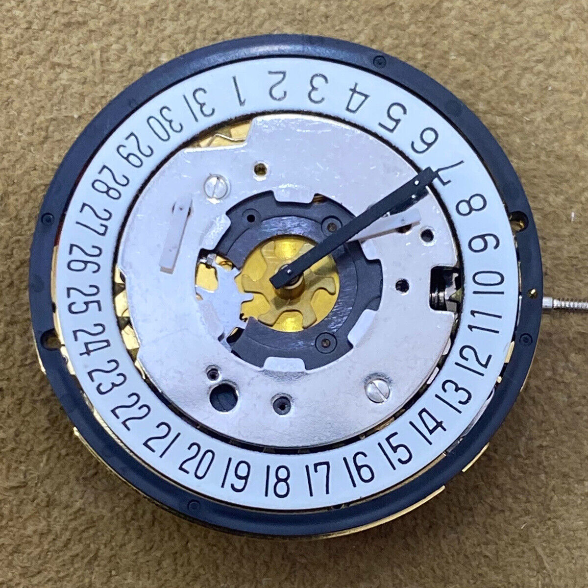 Swiss ISA 8271 golden watch part with quartz movement, multifunctional date display at 6, watch accessory.