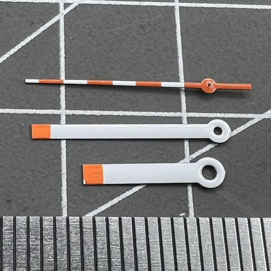 15mm orange and white painted watch hands set for Ronda 515 quartz, perfect for precise timekeeping.