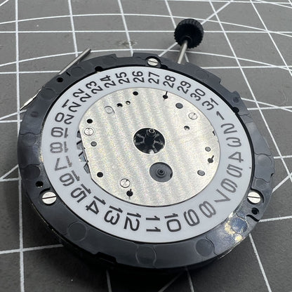 Miyota 6S20 quartz watch movement with date at 3, three hands, small seconds at 6 and 9, precision timekeeping.