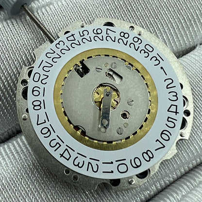 Swiss Made Ronda 705 quartz watch movement with date at 3 and 6 o'clock, precise timekeeping.