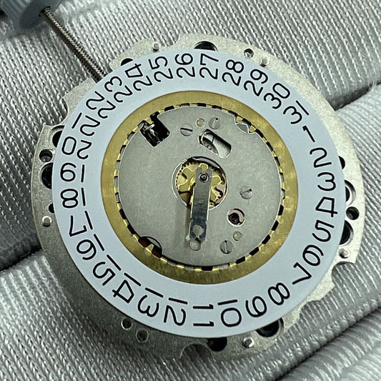 Swiss Made Ronda 705 quartz watch movement with date at 3 and 6 o'clock, precise timekeeping.