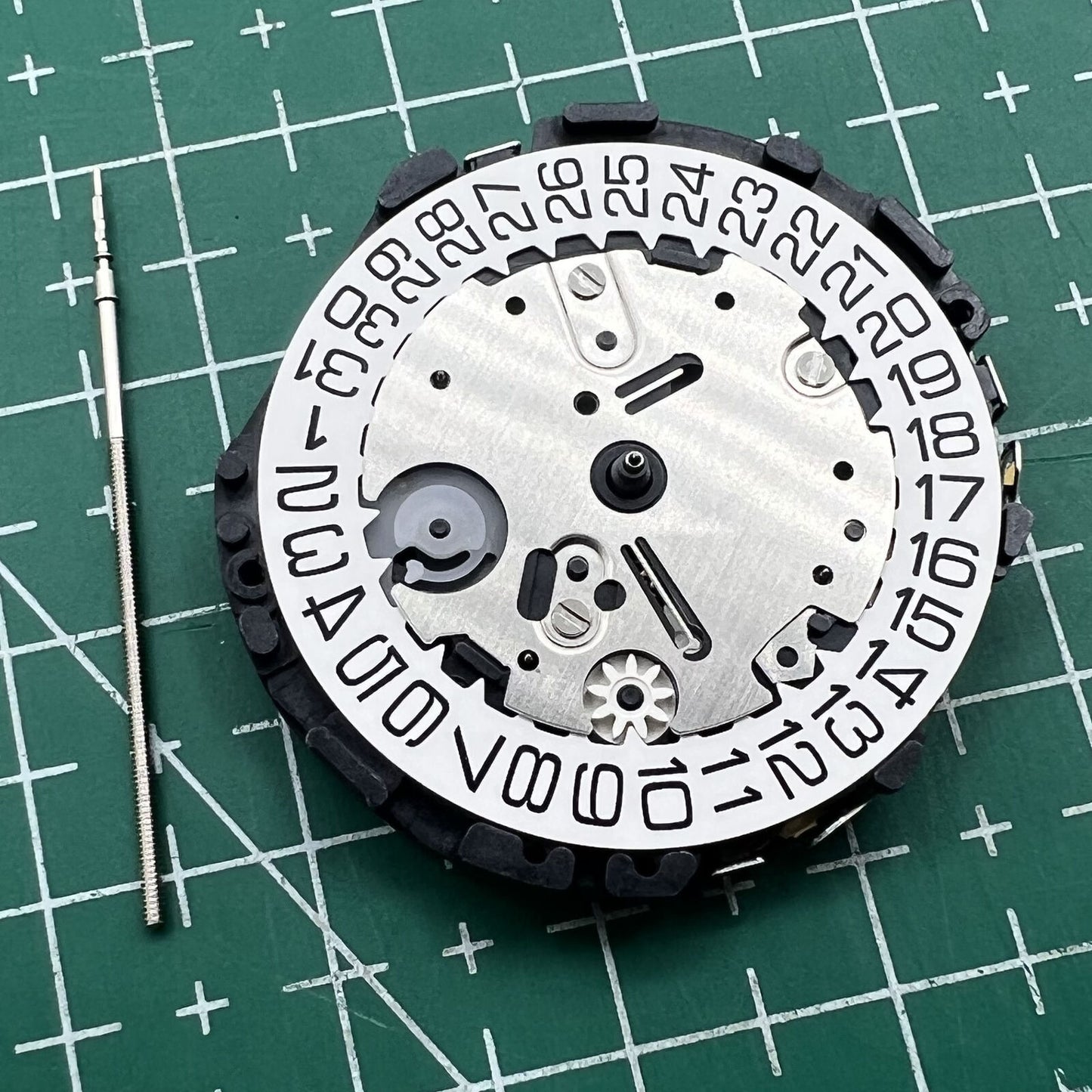 Hattori VR32 Japan quartz chronograph watch movement for precise timekeeping and durability.