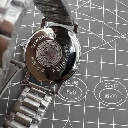 China Baihua 37mm manual mechanical watch with silver dial, 19 jewels, shock-resistant for lasting durability.